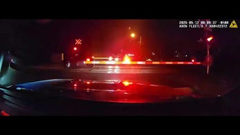 Hero cops drag dazed driver from car before speeding train smashes into it