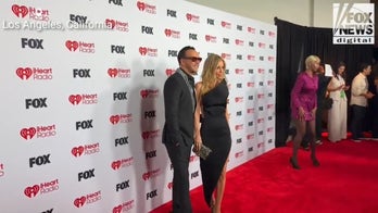 Jenny McCarthy and Donnie Wahlberg walk the red carpet at the 2026 iHeartRadio Music Awards
