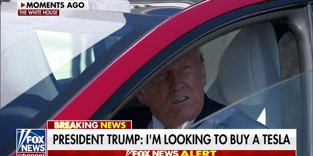 Trump takes the driver's seat in Telsa in show of support for Elon Musk