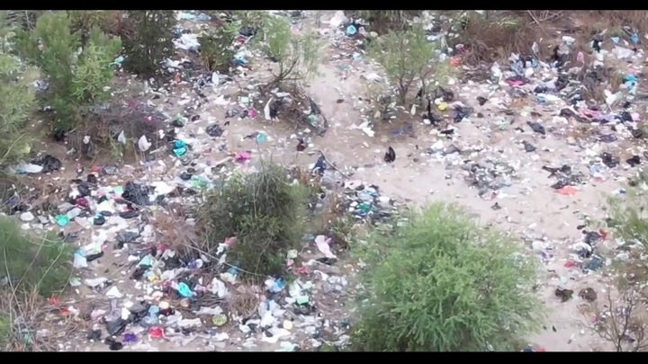 Trash strewn along southern border in Normandy, Texas