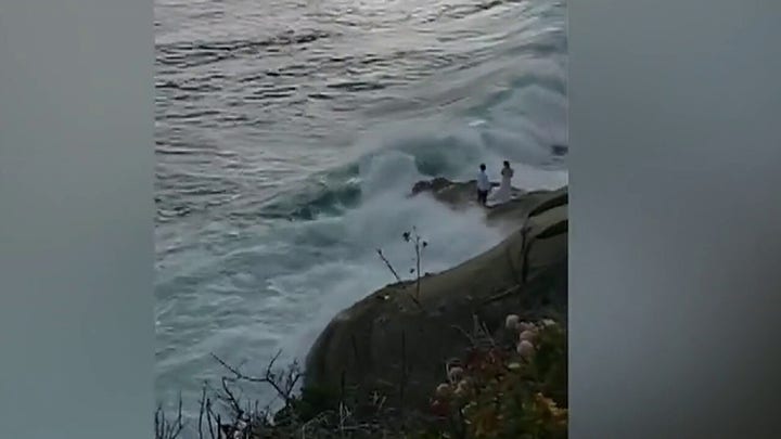 Newlyweds swept into ocean during photo shoot