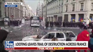 Arrests mount in Paris after half a million take over French streets