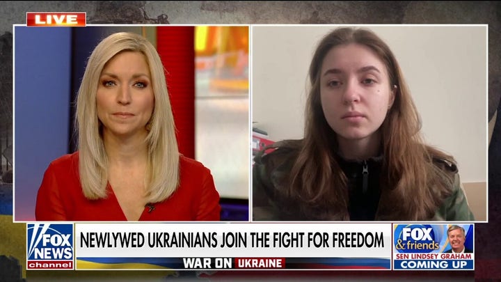 Ukrainian newlyweds vow to defend their country