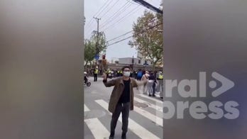 Protester arrested at rally against lockdown in Shanghai, China