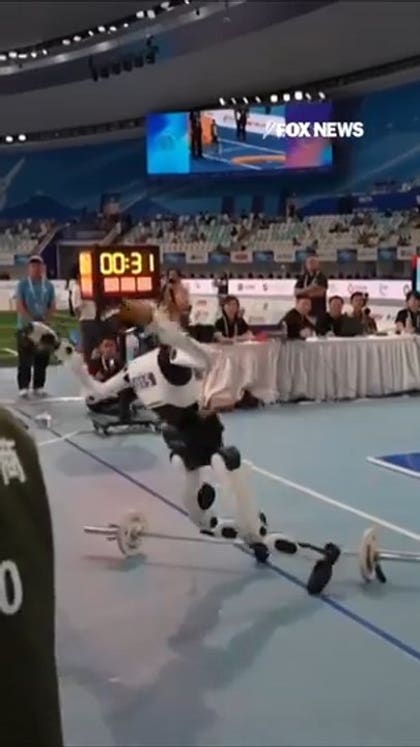 Robot crashes into judges' table during humanoid weightlifting final