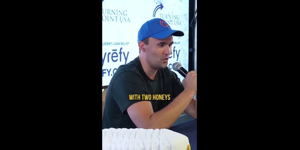 Charlie Kirk is shown describing his favorite Starbucks drink to a young  attendee at event