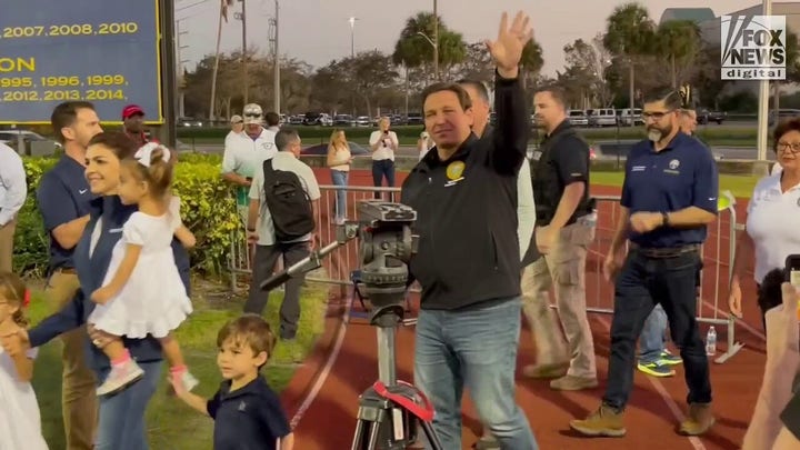 Florida Gov. Ron DeSantis attends high school football days after Hurricane Ian