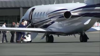 Harjinder Singh boards an airplane as he is extradited to Florida