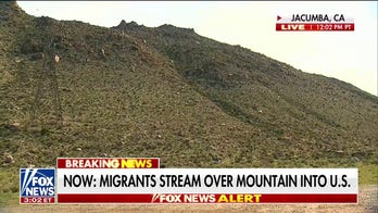 Fox News captures migrants streaming over mountain into US