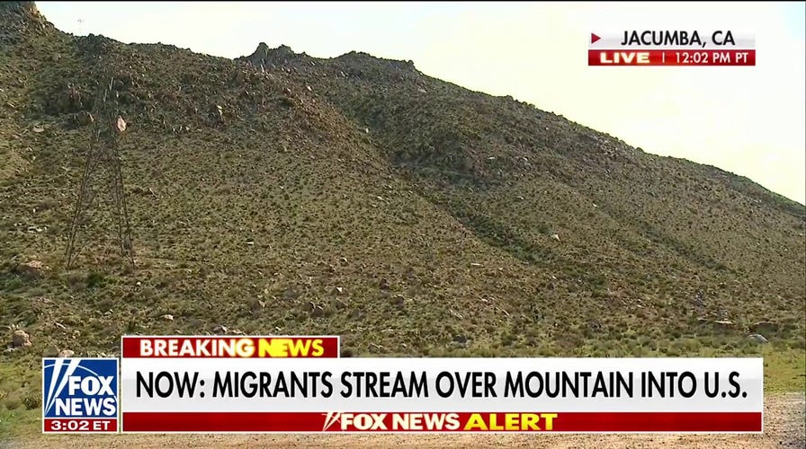Fox News captures migrants streaming over mountain into US