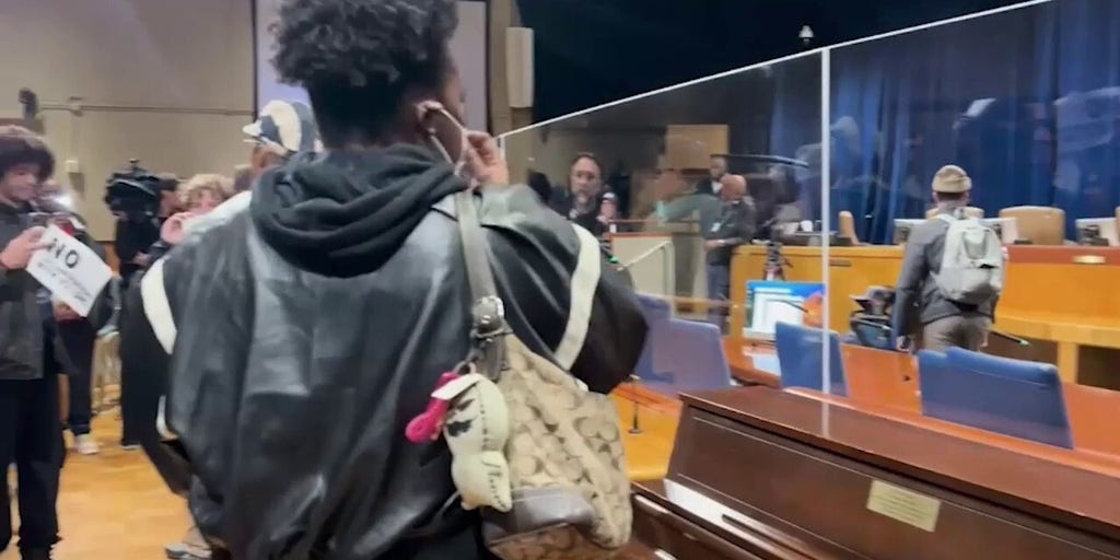 Protesters storm New Orleans council meeting, spark heated clash with officials
