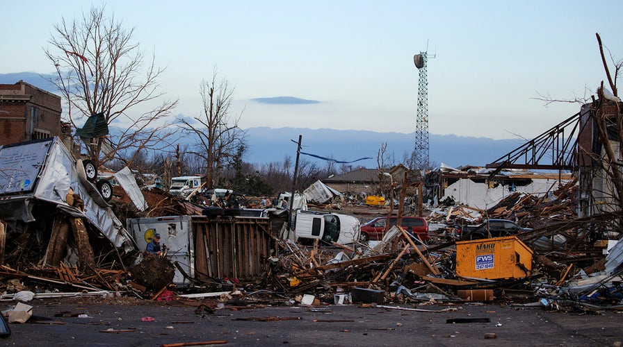 Kentucky Gov. Andy Beshear holds a press briefing after a severe storm swept through the state overnight causing a 'significant loss of life'