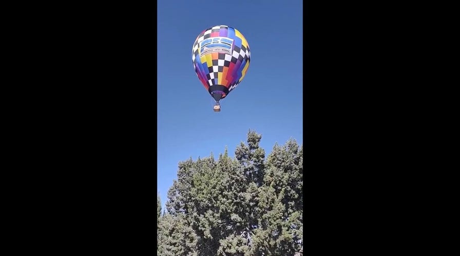  Hot air balloon lands in neighbor’s backyard