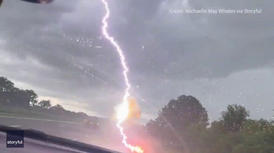 Woman in Florida films moment lightning strikes vehicle in front of her