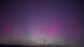 Aurora lights up night sky over Lake Michigan - Fox News