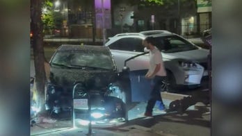 Hatchet-wielding man caught on camera hitting a car in Boston