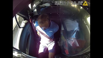 Tiger Woods reacts to getting arrested after car crash