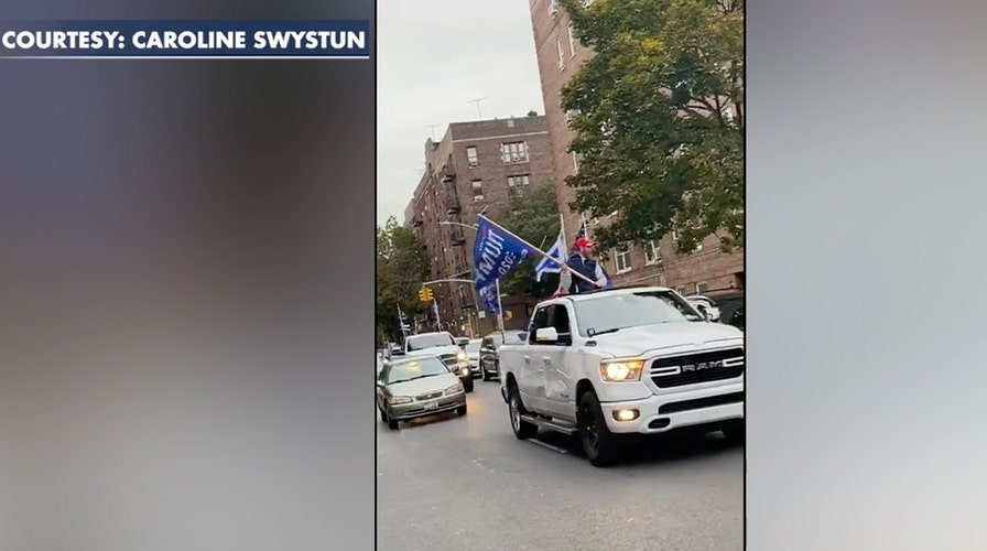 Pro-Trump car parade passes down a street in a New York City's Brooklyn borough