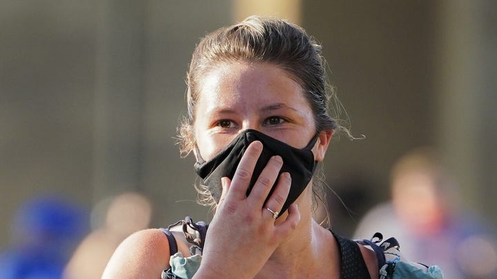 Some US cities reinstate mask mandates