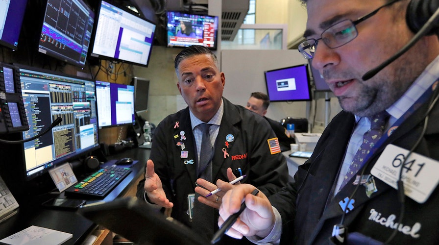 Trump tries to calm coronavirus fears as markets get spooked over spread of the disease