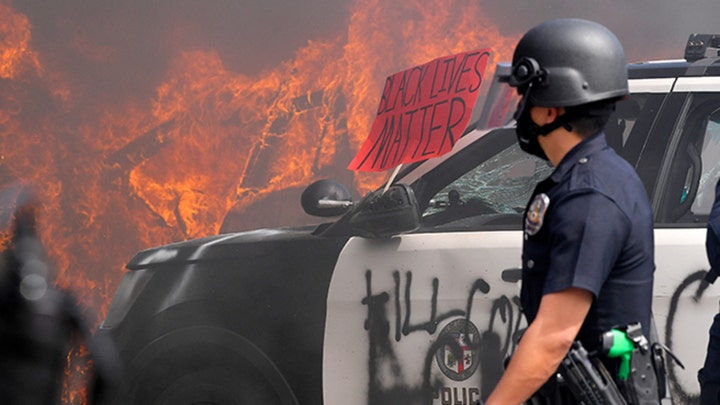 LAPD squad cars vandalized as police officers push back protesters near Beverly Hills