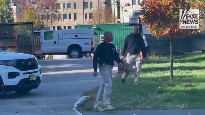 Police and law enforcement officers leaving an apparent scene eight-tenths of a mile from where Misrach Ewunetie was last seen.