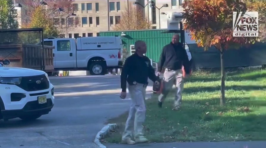 Police and law enforcement officers leaving an apparent scene eight-tenths of a mile from where Misrach Ewunetie was last seen.