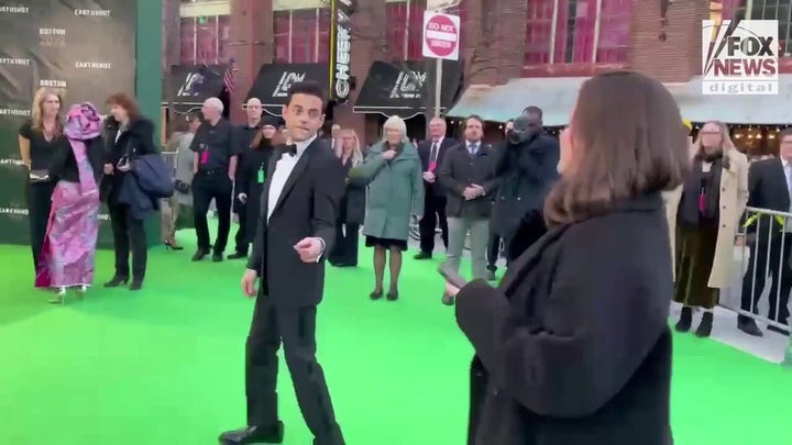 Rami Malek walks the green carpet at the Earthshot Prize Awards