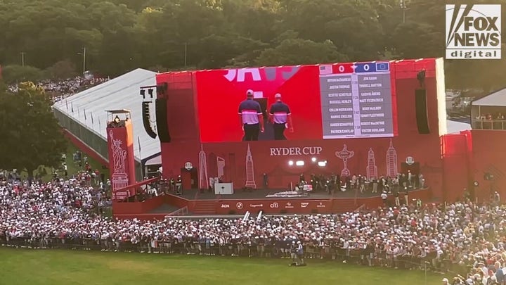 Bryson DeChambeau and Justin Thomas walk out to tee off at 2025 Ryder Cup