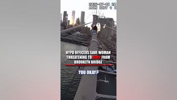 NYPD officers SAVE woman threatening to JUMP from Brooklyn Bridge