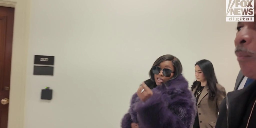 Far-left lawmaker dodges questions about why her office hired security guard with record of criminal past.