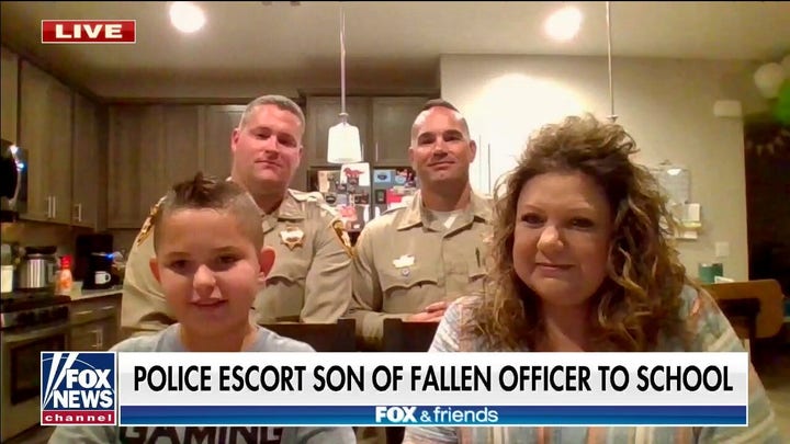 Las Vegas police escort son of fallen officer to school: 'Important for us' to see him happy
