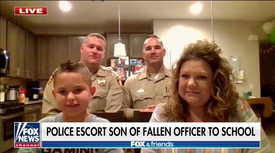 Las Vegas police escort son of fallen officer to school: 'Important for us' to see him happy