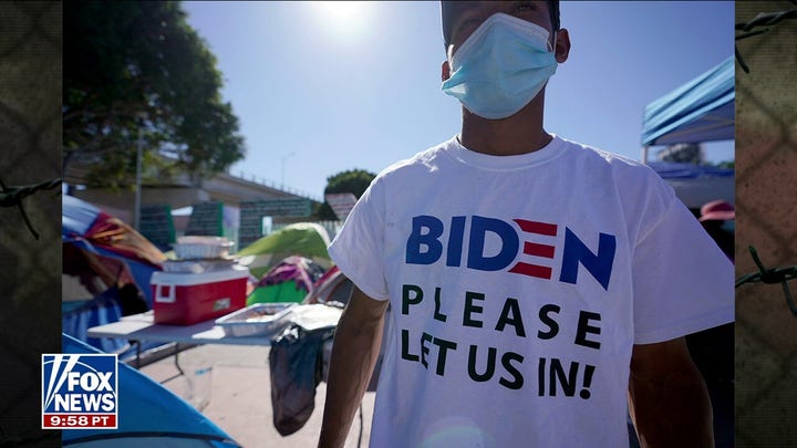 A migrant wears Biden t-shirt at border so they can let me in