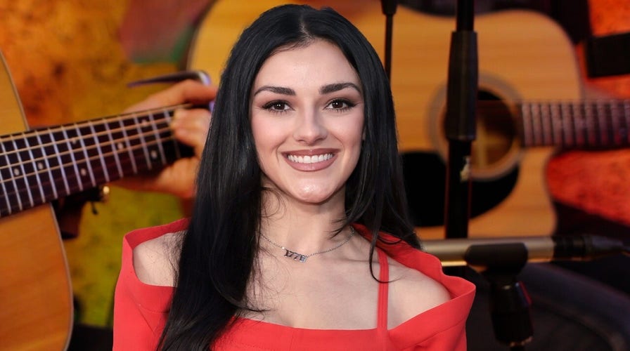Country artist refuses to 'bend the knee' when told to remove American flag from social media