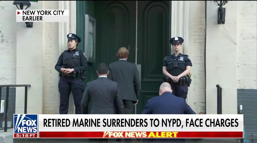 Marine veteran surrenders in NYC to face charges