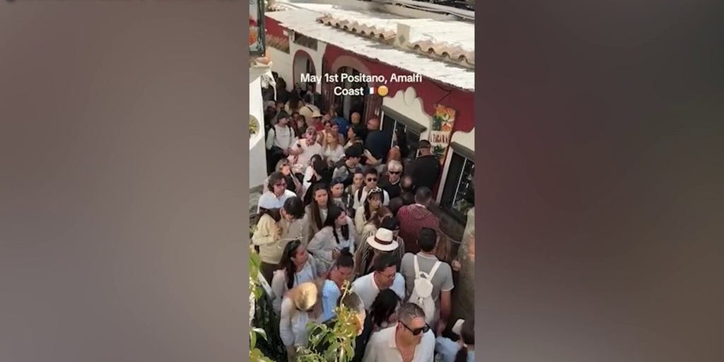 Shoulder-to-shoulder crowds choke narrow walkways along Italy’s Amalfi Coast