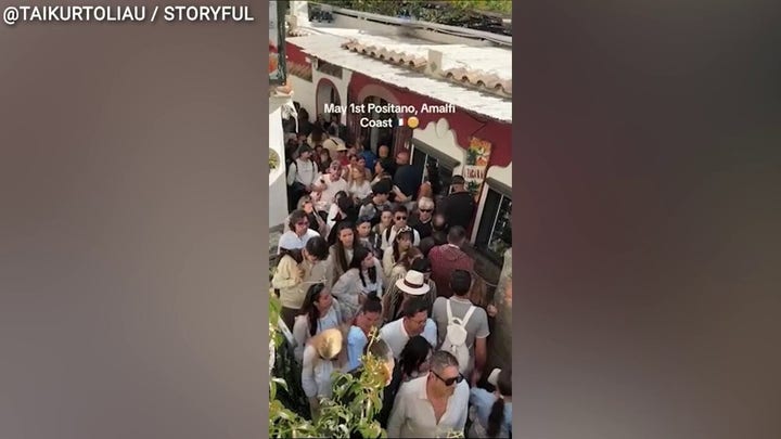 Shoulder-to-shoulder crowds choke narrow walkways along Italy’s Amalfi Coast