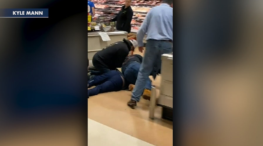 Customers subdue man who allegedly coughed and spit on store's produce 