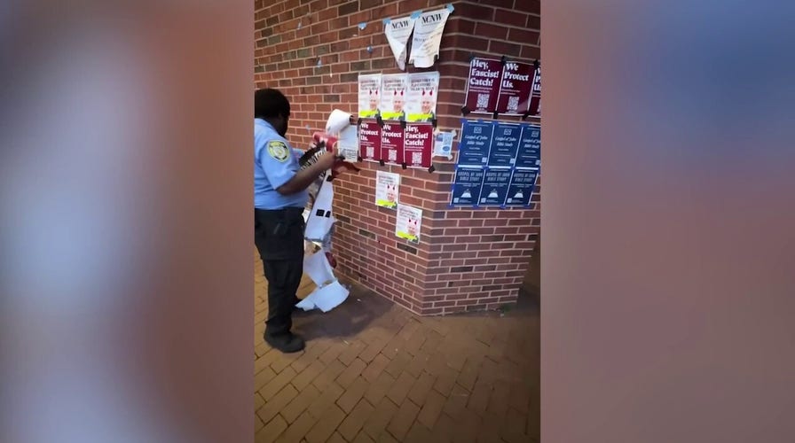 Georgetown University Police Department officer spotted removing “Hey fascist! Catch!” flyers from campus