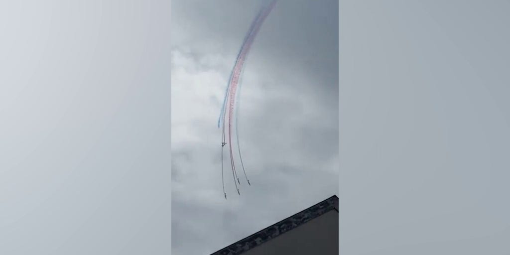 Military jets collide in midair stunt as pilots parachute to safety