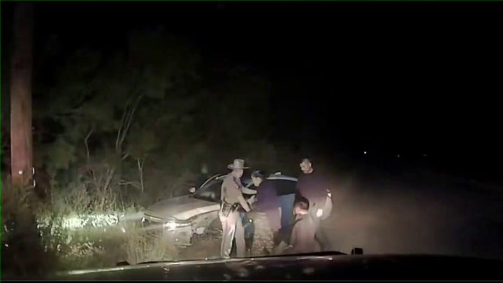 Dashcam video shows alleged human trafficker crash with three migrants in his car after high-speed chase