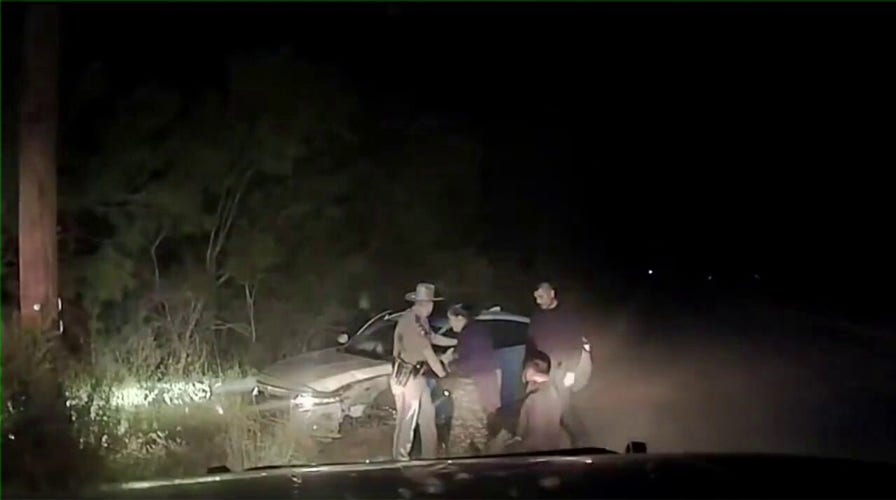 Dashcam video shows alleged human trafficker crash with three migrants in his car after high-speed chase