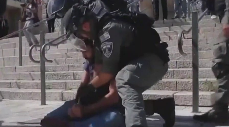 Palestinian protesters clash with Israeli soldiers as rocket fire continues