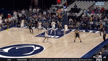 Michigans' L.J. Cason lobs it up to Aday Mara, who throws down a slam dunk vs. Penn State