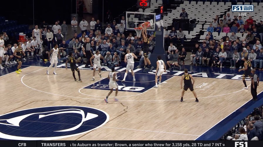 Michigans' L.J. Cason lobs it up to Aday Mara, who throws down a slam dunk vs. Penn State