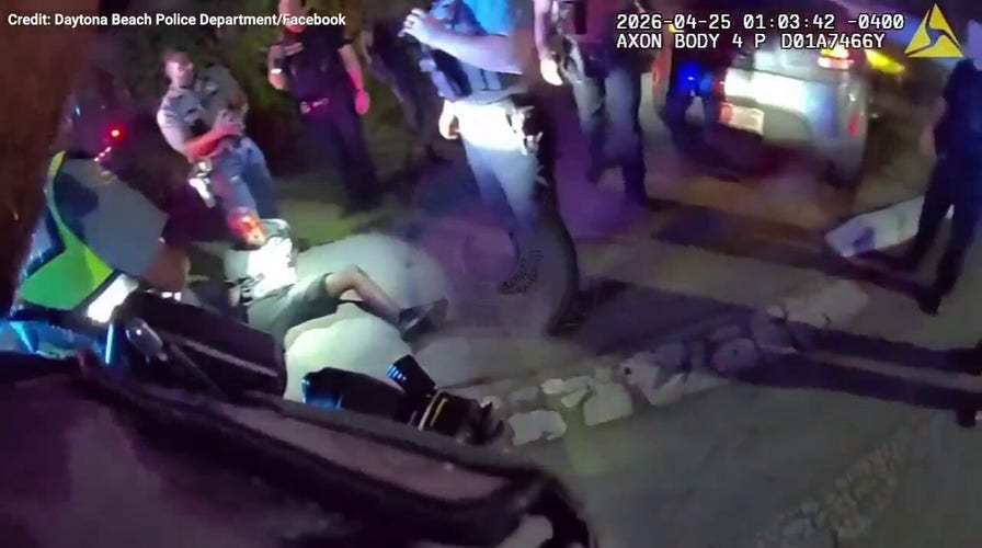 WATCH: Bodycam catches dad’s alleged mad dash with child into woods during police pursuit