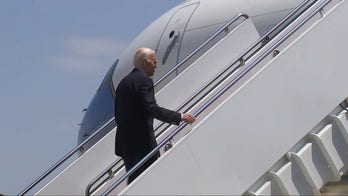Reporter shouts question at Biden as he boards Air Force One