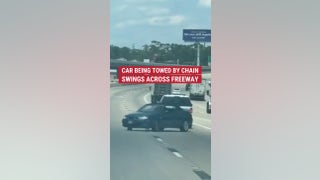 Wild moment caught on cam of a car being towed with only chain swerves out of control on a freeway - Fox News