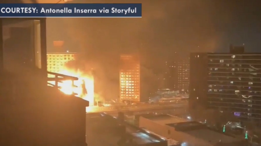 Truck carrying propane tanks bursts into flames